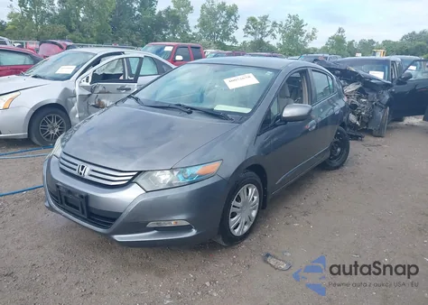 2011 Honda Insight from USA, damaged, VIN JHMZE2H34BS005548